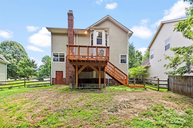 7425 Hubbard Woods Rd, Charlotte, NC 28269 - back of property with a deck, a fenced backyard, a chimney, and stairs