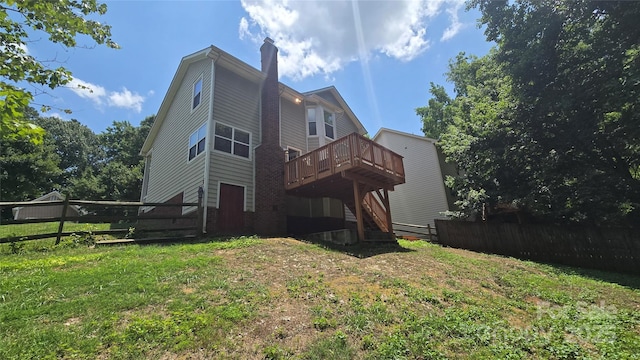 7425 Hubbard Woods Rd, Charlotte, NC 28269 - back of house featuring a wooden deck, a chimney, and stairway