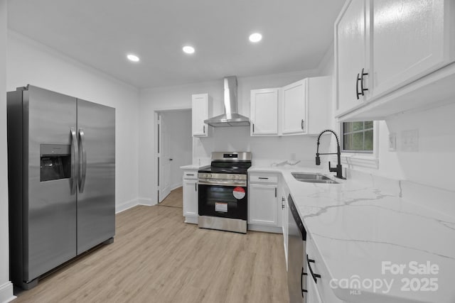 442 Lovelace Rd, Rock Hill, SC 29730 - kitchen featuring stainless steel appliances, wall chimney range hood, light stone countertops, white cabinets, and light wood-type flooring