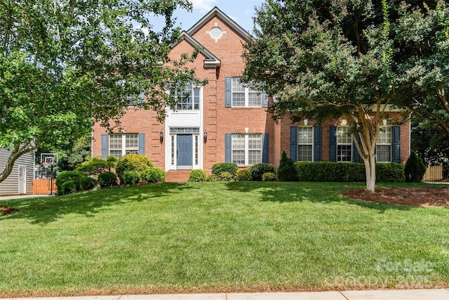 1002 Hollyhedge Ln, Indian Trail, NC 28079 - view of front of house featuring a front yard and brick siding