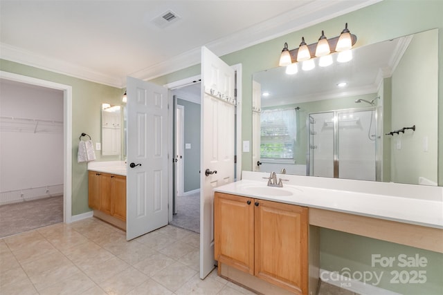 1002 Hollyhedge Ln, Indian Trail, NC 28079 - bathroom with ornamental molding, a shower stall, vanity, a spacious closet, and tile patterned flooring