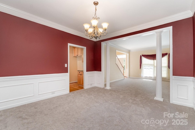 1002 Hollyhedge Ln, Indian Trail, NC 28079 - empty room with light carpet, crown molding, a chandelier, wainscoting, and stairway