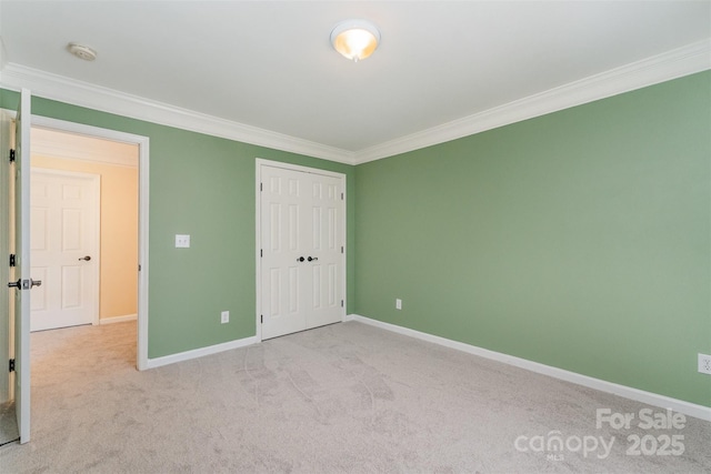 1002 Hollyhedge Ln, Indian Trail, NC 28079 - unfurnished bedroom with crown molding, carpet, and a closet