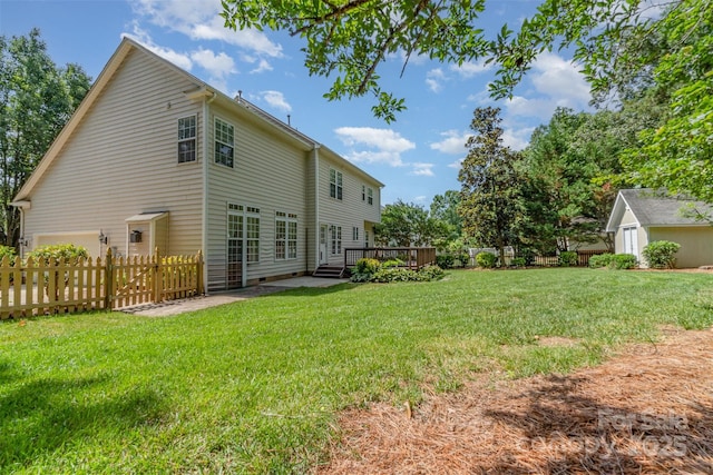 1002 Hollyhedge Ln, Indian Trail, NC 28079 - rear view of property with a fenced backyard and a wooden deck