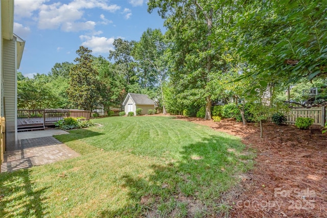 1002 Hollyhedge Ln, Indian Trail, NC 28079 - view of yard featuring a deck, an outbuilding, and a patio area