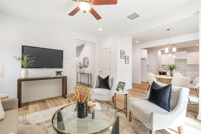 4226 Acorn St, Charlotte, NC 28205 - living room featuring a ceiling fan, light wood-style floors, recessed lighting, and baseboards