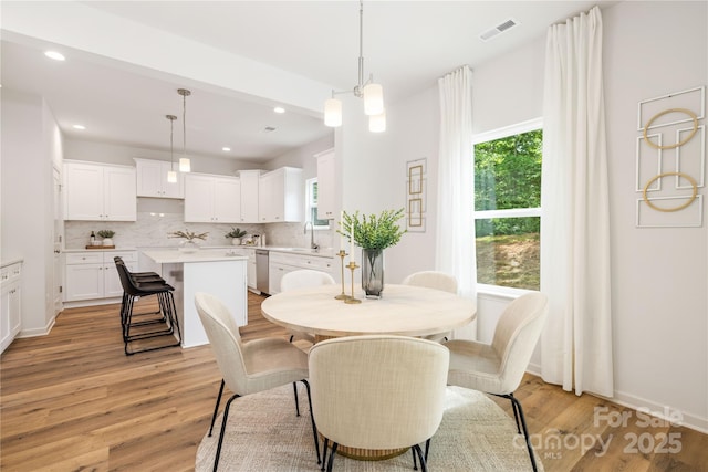 4226 Acorn St, Charlotte, NC 28205 - dining area featuring plenty of natural light, light wood-style floors, and recessed lighting