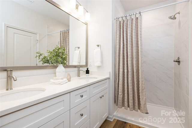 4226 Acorn St, Charlotte, NC 28205 - full bathroom with double vanity and a tile shower