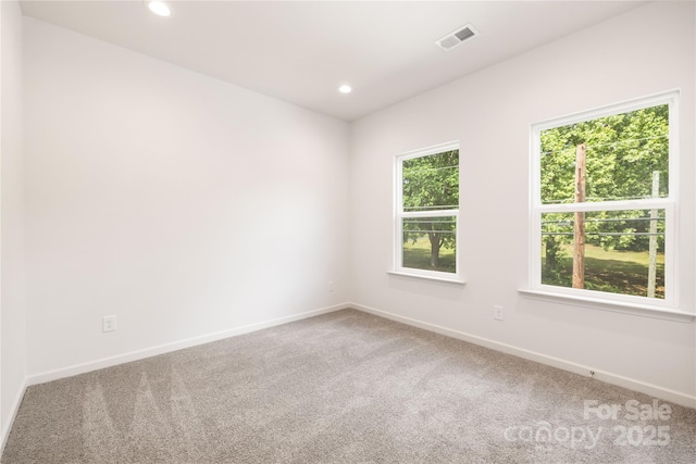 4226 Acorn St, Charlotte, NC 28205 - carpeted spare room with baseboards and recessed lighting