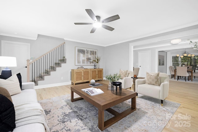 715 White Oaks Cir, Monroe, NC 28110 - living area with stairway, wood finished floors, crown molding, and ceiling fan