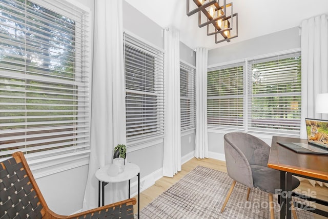 715 White Oaks Cir, Monroe, NC 28110 - office area featuring a chandelier and light wood finished floors