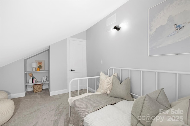 715 White Oaks Cir, Monroe, NC 28110 - carpeted bedroom featuring vaulted ceiling and baseboards
