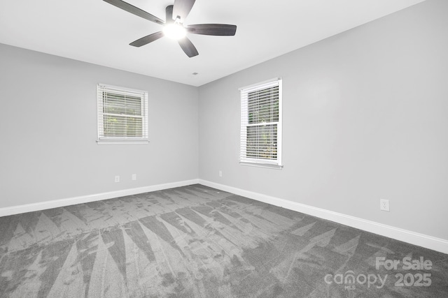 715 White Oaks Cir, Monroe, NC 28110 - spare room featuring dark colored carpet and a ceiling fan