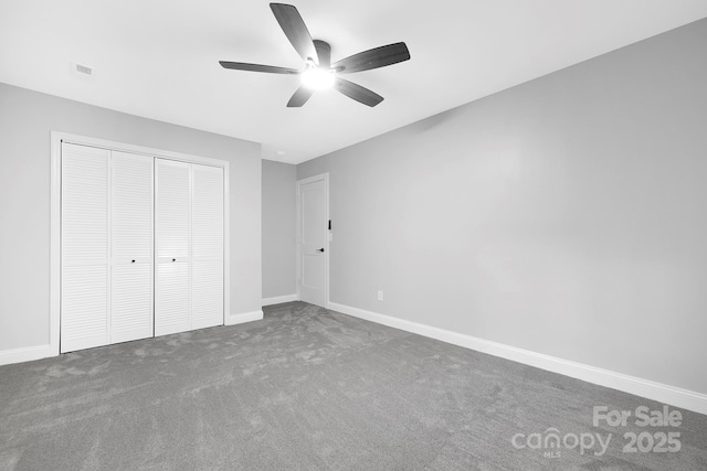 715 White Oaks Cir, Monroe, NC 28110 - unfurnished bedroom featuring a closet, carpet, and a ceiling fan