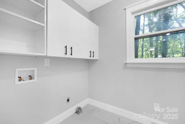 715 White Oaks Cir, Monroe, NC 28110 - laundry area featuring cabinet space, washer hookup, electric dryer hookup, and marble look tiles