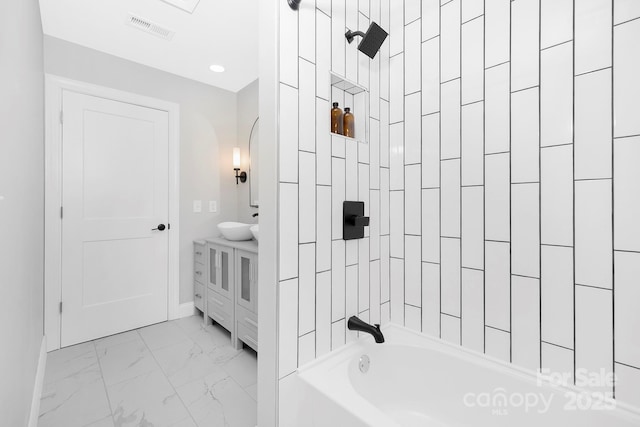 715 White Oaks Cir, Monroe, NC 28110 - bathroom featuring marble look tile flooring, vanity, and shower / bathtub combination