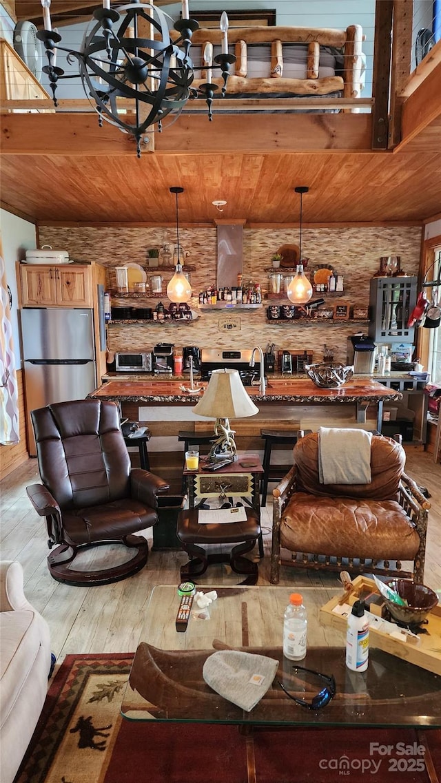 871 Lower Nettle Knob Rd, West Jefferson, NC 28694 - living room featuring wood-type flooring, wooden ceiling, and a chandelier