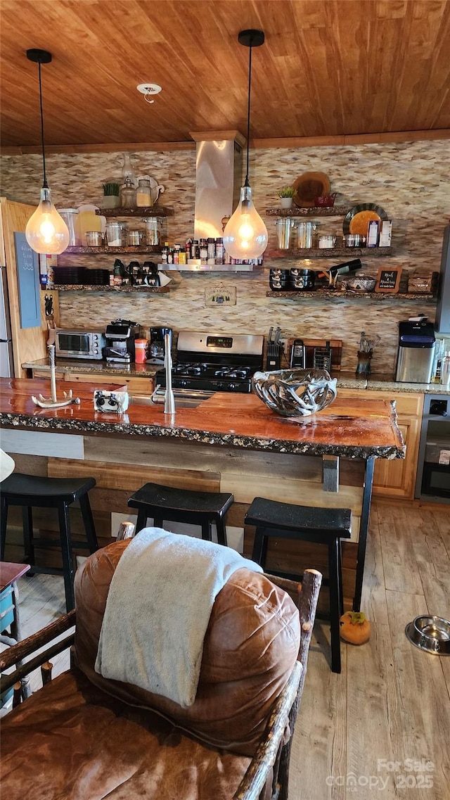 871 Lower Nettle Knob Rd, West Jefferson, NC 28694 - bar featuring wood ceiling, stainless steel appliances, light wood-style floors, and hanging light fixtures