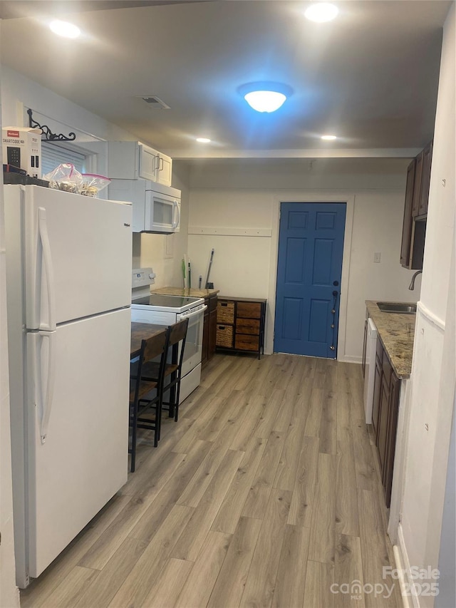 659 Annafrel St, Rock Hill, SC 29730 - kitchen with white appliances, light wood-type flooring, and light stone countertops