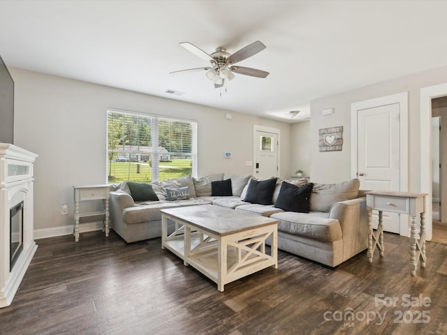 429 Summer Ridge Dr, Stanley, NC 28164 - living area with ceiling fan, dark wood-type flooring, and a glass covered fireplace