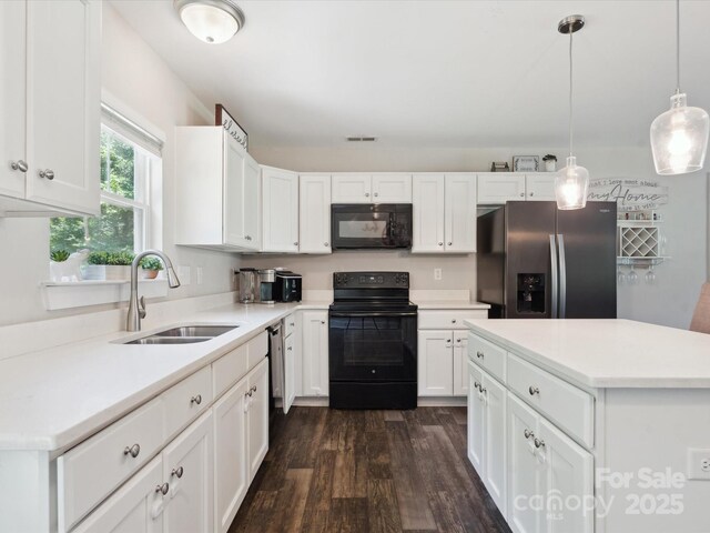 429 Summer Ridge Dr, Stanley, NC 28164 - kitchen with black appliances, dark wood-style floors, white cabinetry, and light countertops