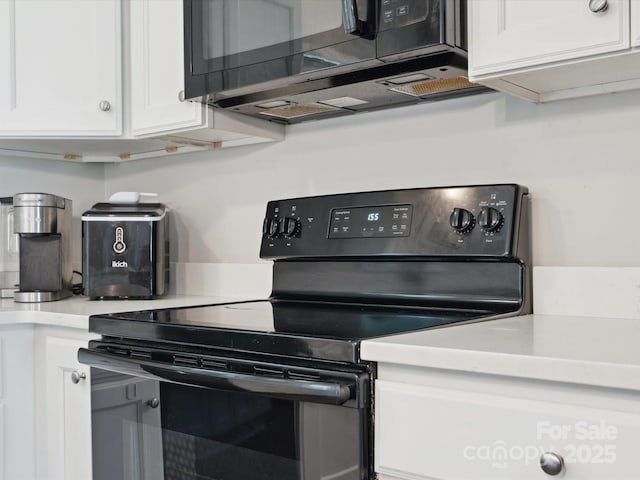 429 Summer Ridge Dr, Stanley, NC 28164 - kitchen featuring black / electric stove, white cabinets, and light countertops