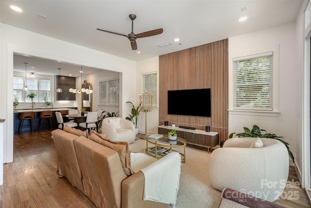 3026 Kalex Ct, Charlotte, NC 28204 - living room featuring wood finished floors, a ceiling fan, and recessed lighting