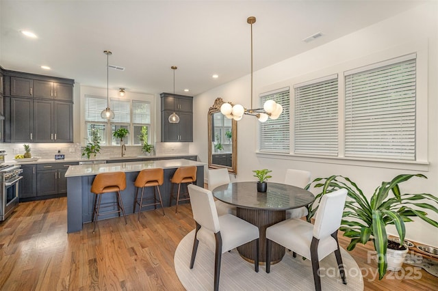 3026 Kalex Ct, Charlotte, NC 28204 - dining room with light wood finished floors and recessed lighting