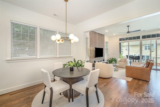 3026 Kalex Ct, Charlotte, NC 28204 - dining room featuring wood finished floors, ceiling fan, a chandelier, and recessed lighting