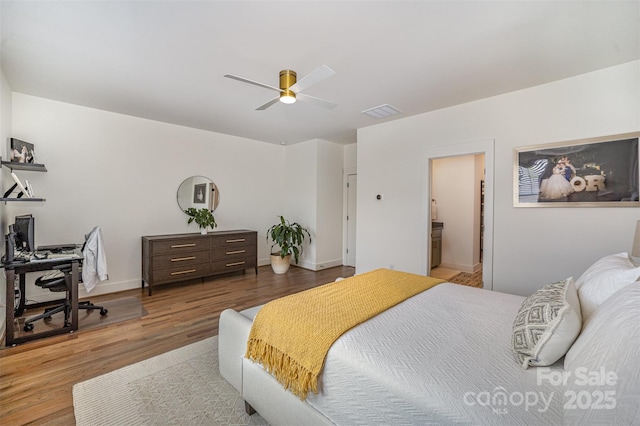 3026 Kalex Ct, Charlotte, NC 28204 - bedroom featuring wood finished floors, a desk, a ceiling fan, and ensuite bath