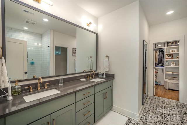 3026 Kalex Ct, Charlotte, NC 28204 - full bathroom with double vanity, a stall shower, a walk in closet, recessed lighting, and wood finished floors