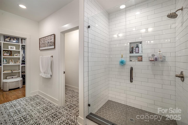 3026 Kalex Ct, Charlotte, NC 28204 - bathroom featuring a stall shower, a spacious closet, and recessed lighting