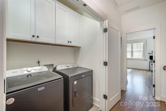3026 Kalex Ct, Charlotte, NC 28204 - laundry room with cabinet space, independent washer and dryer, and wood finished floors