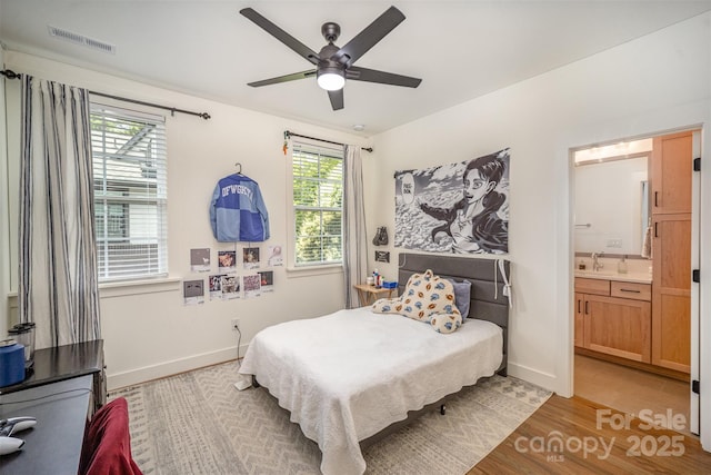3026 Kalex Ct, Charlotte, NC 28204 - bedroom featuring light wood-style floors, ensuite bathroom, and a ceiling fan