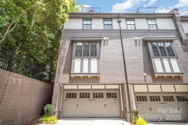 3026 Kalex Ct, Charlotte, NC 28204 - view of front facade with an attached garage, brick siding, and concrete driveway