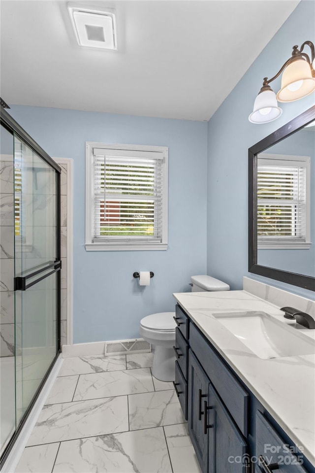 2229 Old Wilkesboro Rd, Statesville, NC 28625 - full bathroom featuring vanity, toilet, a stall shower, and marble finish flooring