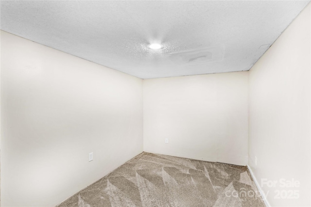 2229 Old Wilkesboro Rd, Statesville, NC 28625 - unfurnished room featuring carpet floors and a textured ceiling