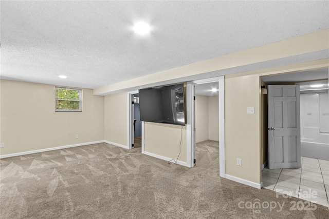 2229 Old Wilkesboro Rd, Statesville, NC 28625 - basement featuring a textured ceiling, carpet, and baseboards