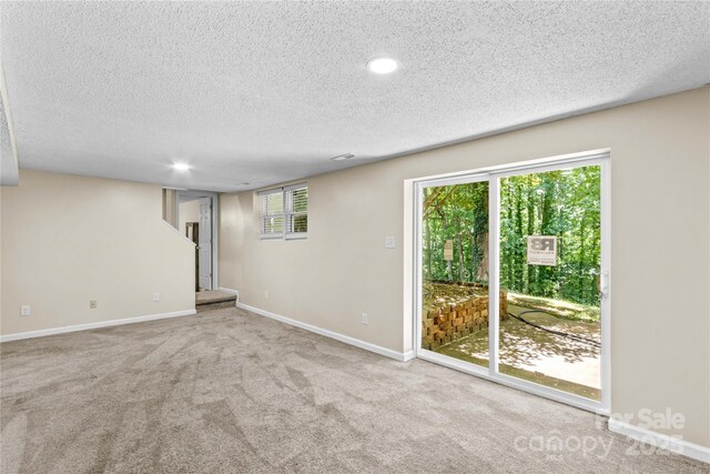 2229 Old Wilkesboro Rd, Statesville, NC 28625 - spare room featuring a textured ceiling, carpet flooring, baseboards, and recessed lighting