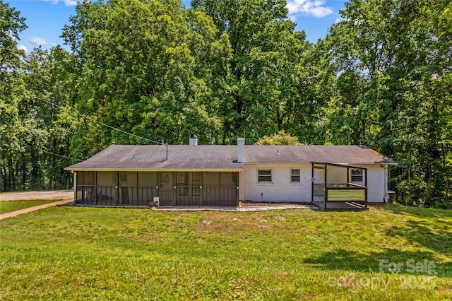 2229 Old Wilkesboro Rd, Statesville, NC 28625 - rear view of property with a sunroom, a yard, and a chimney