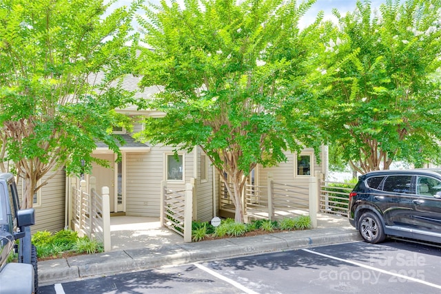 14053 Queens Harbor Rd, Charlotte, NC 28278 - view of front facade featuring uncovered parking