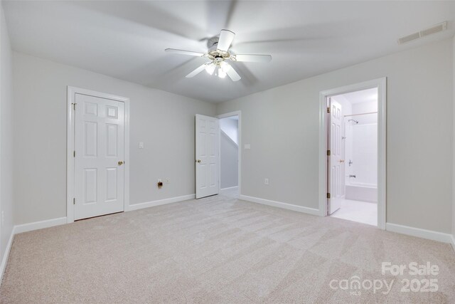 14053 Queens Harbor Rd, Charlotte, NC 28278 - unfurnished bedroom featuring carpet flooring, ensuite bathroom, and a ceiling fan