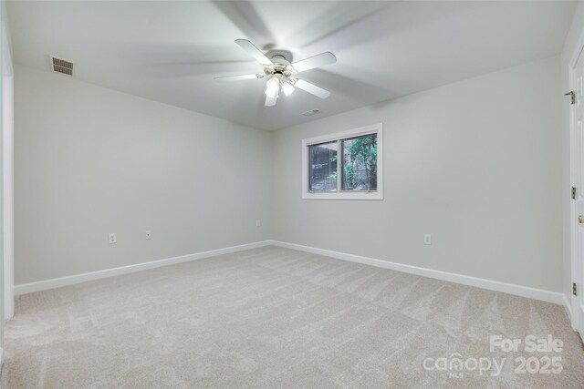 14053 Queens Harbor Rd, Charlotte, NC 28278 - spare room featuring light colored carpet and a ceiling fan