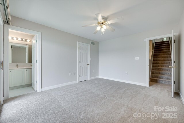 14053 Queens Harbor Rd, Charlotte, NC 28278 - unfurnished bedroom with a closet, light carpet, baseboards, and ensuite bathroom