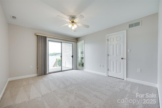 14053 Queens Harbor Rd, Charlotte, NC 28278 - unfurnished bedroom featuring access to outside, carpet flooring, and a ceiling fan