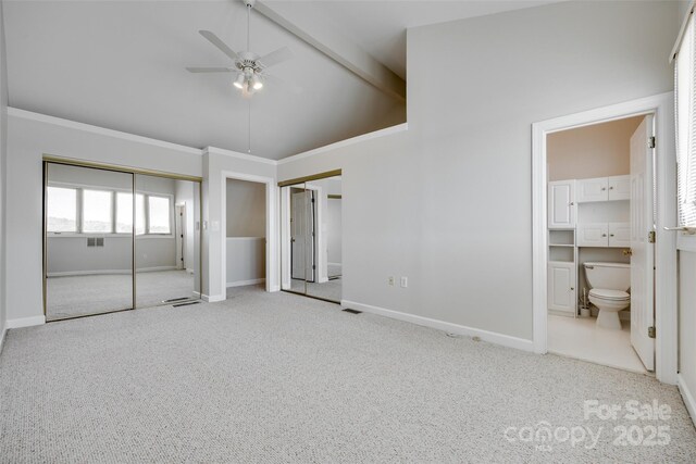 14053 Queens Harbor Rd, Charlotte, NC 28278 - unfurnished bedroom featuring carpet flooring, multiple closets, baseboards, and connected bathroom
