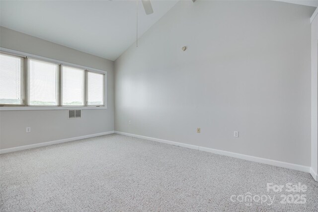 14053 Queens Harbor Rd, Charlotte, NC 28278 - carpeted spare room with vaulted ceiling and a ceiling fan