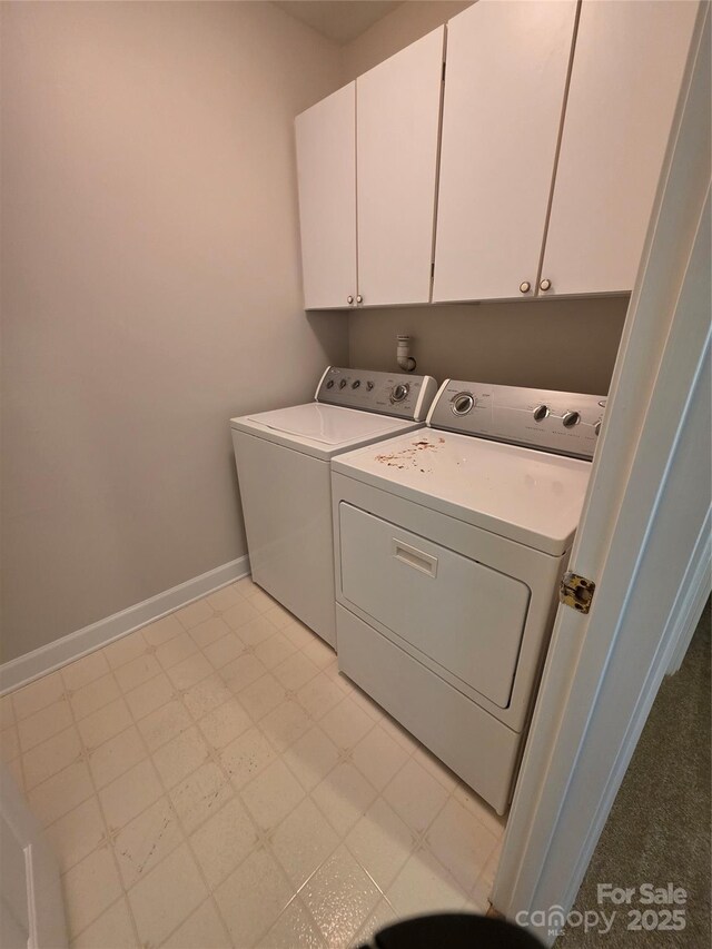 14053 Queens Harbor Rd, Charlotte, NC 28278 - washroom with washer and clothes dryer, cabinet space, and light flooring