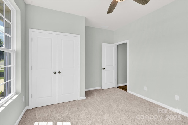 3207 Selwyn Landing Dr, Charlotte, NC 28215 - unfurnished bedroom with carpet floors, a closet, and a ceiling fan