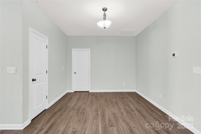 3207 Selwyn Landing Dr, Charlotte, NC 28215 - unfurnished room with wood finished floors and baseboards